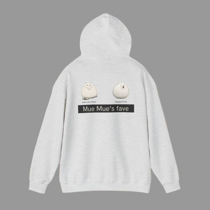A person wearing a white hoodie with a graphic design on the back, featuring two cartoon cats and the text 'Mue Mue's fave'.