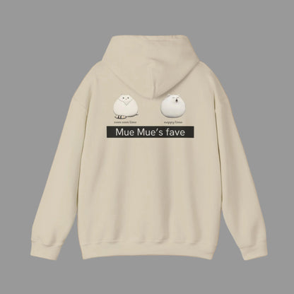 A person wearing a white hoodie with a graphic design on the back, featuring two cartoon cats and the text 'Mue Mue's fave'.