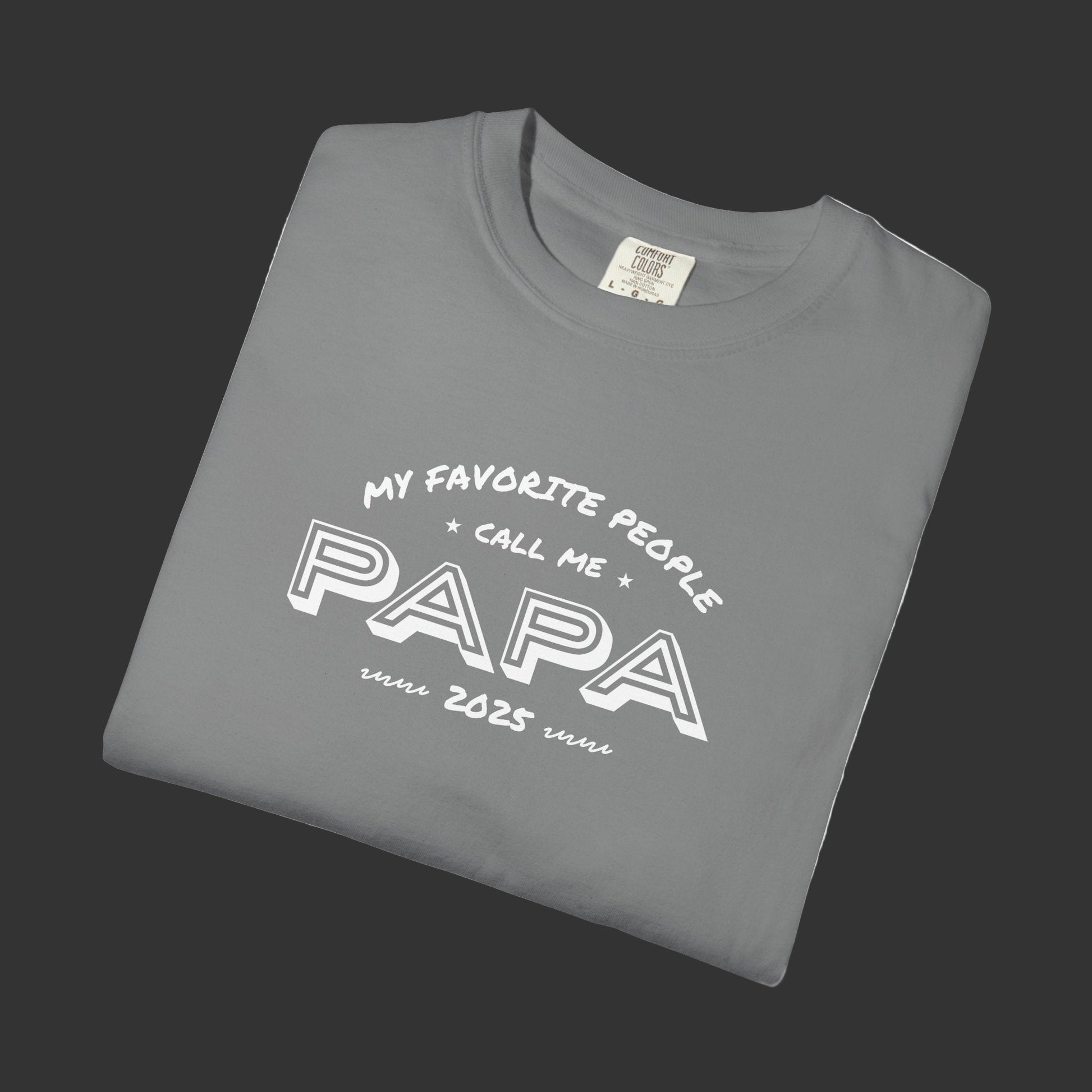 Folded gray t-shirt with 'My favorite people call me papa' text on a white background