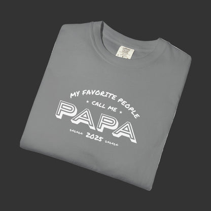 Folded gray t-shirt with 'My favorite people call me papa' text on a white background