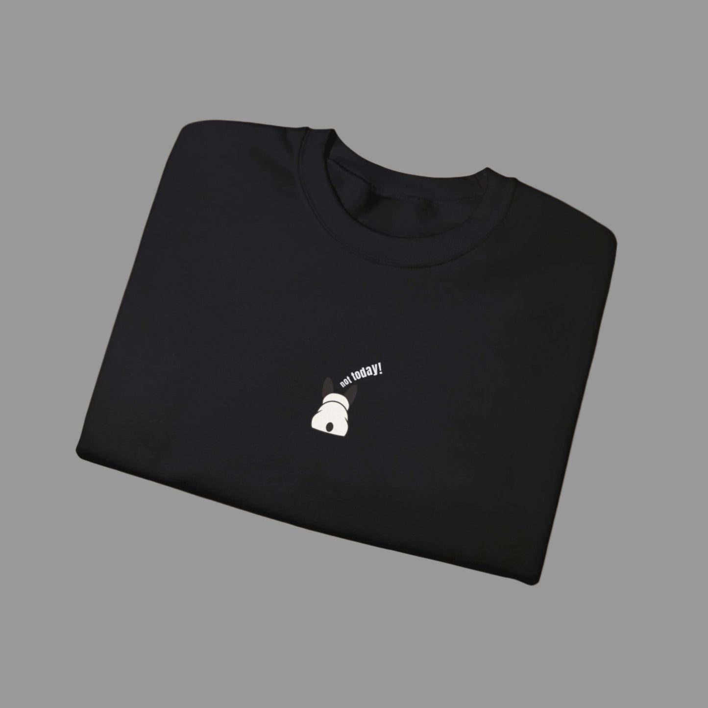 Folded black sweatshirt with a small white graphic and text on a white background