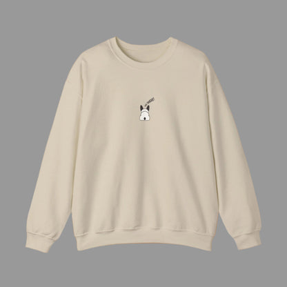 Gray sweatshirt with a small graphic on the chest against a white background