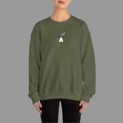 Person wearing a green sweatshirt with a small white graphic on a white background