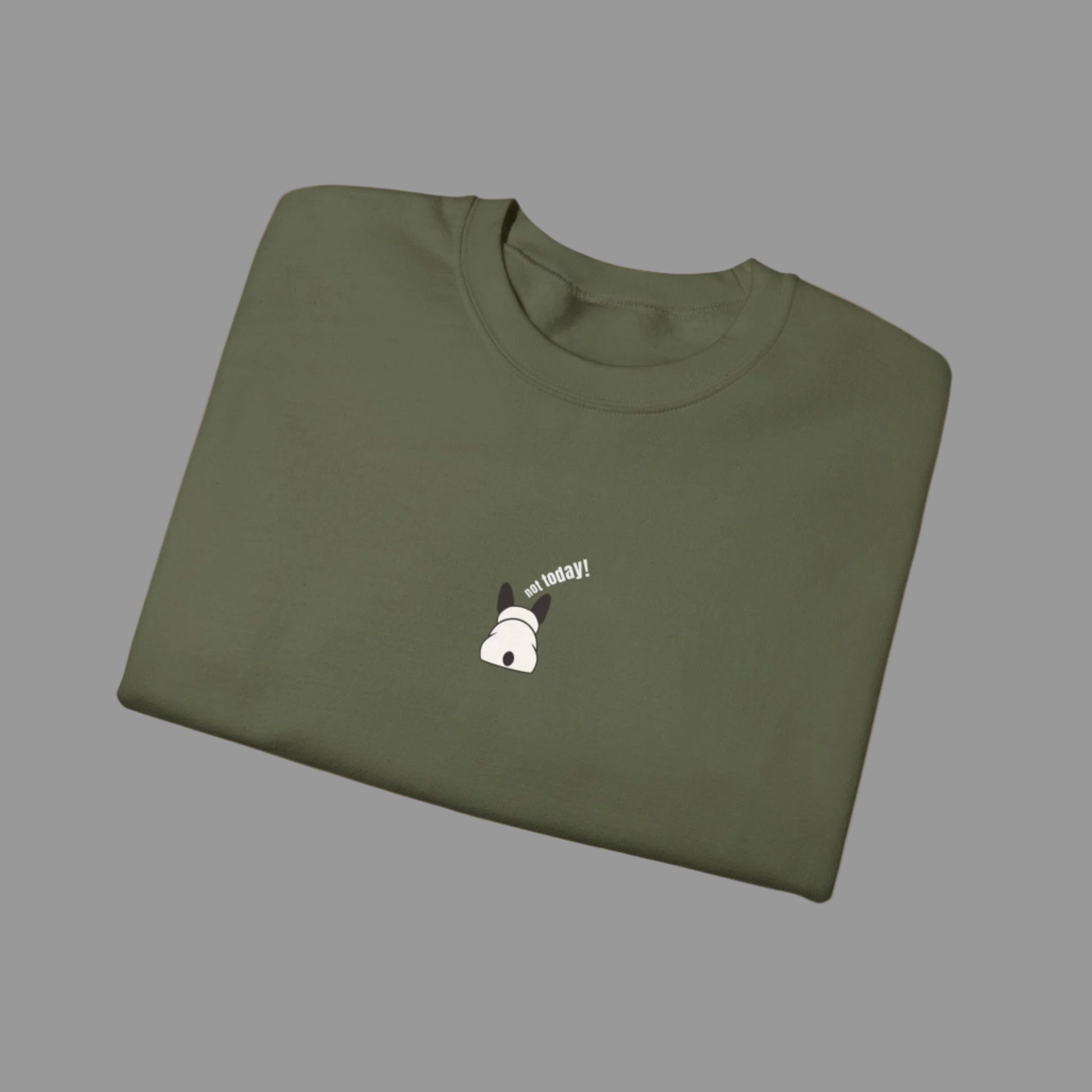 Folded green t-shirt with a small white graphic and text on a white background