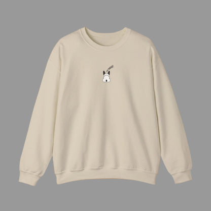 Beige sweatshirt with a small graphic on the chest against a white background