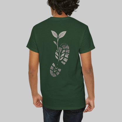 Person wearing a green t-shirt with a leaf design on the back against a white background