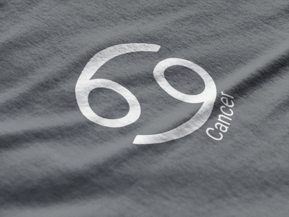 Gray t-shirt with '69 Cancer' printed in white on a textured fabric background