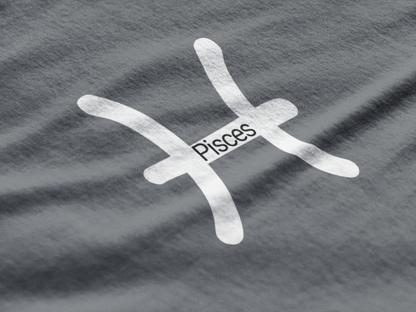Pisces zodiac symbol on a gray fabric background