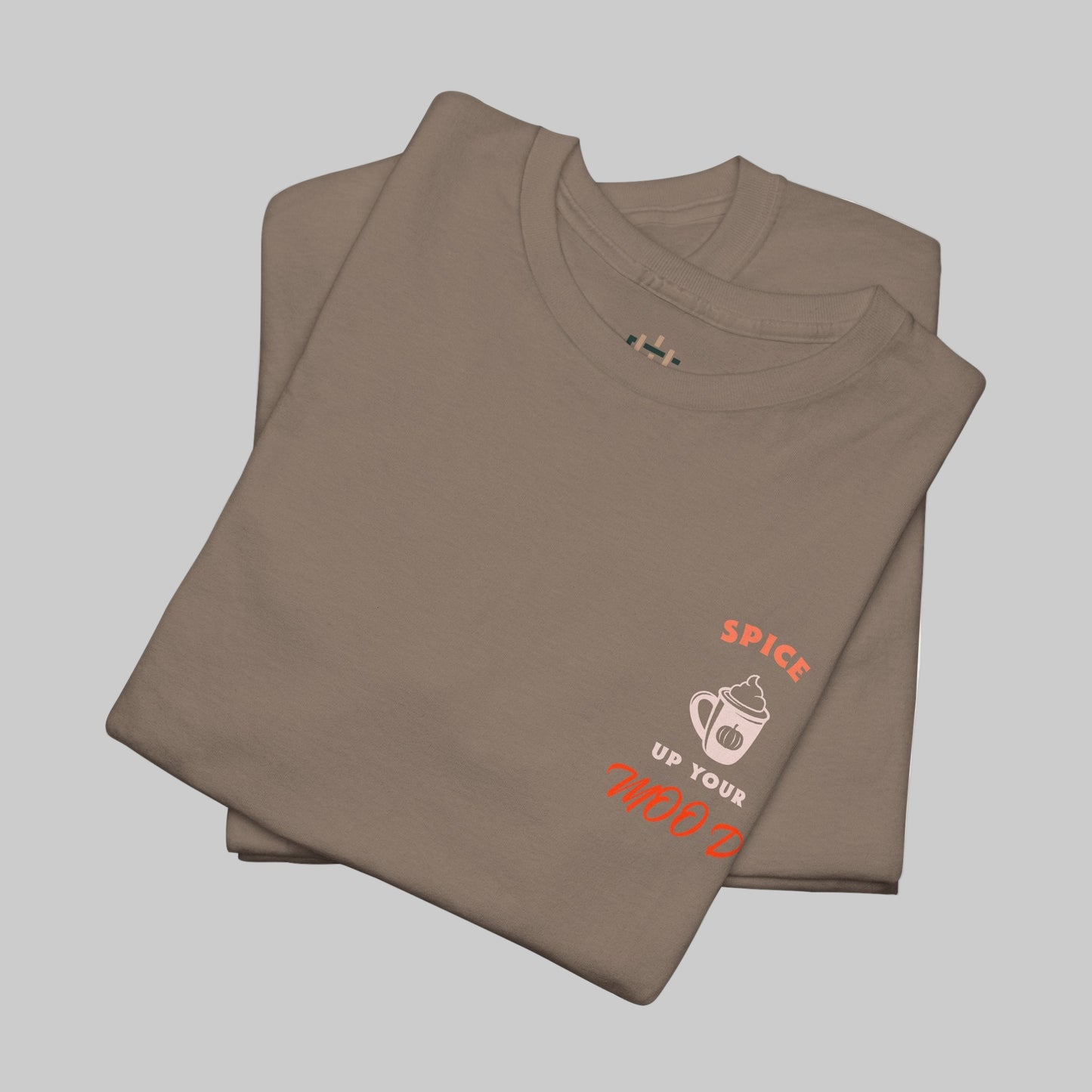Folded brown t-shirt with text and graphic on a white background