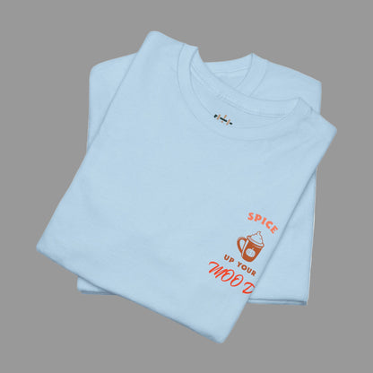 Folded light blue t-shirt with orange text and graphics on a white background