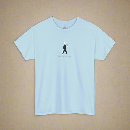 Light blue t-shirt with a small graphic and text on a white background