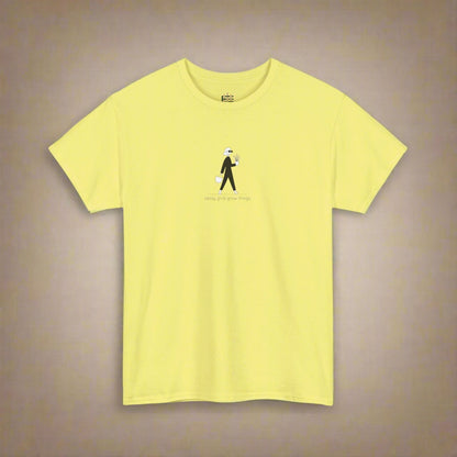Yellow t-shirt with a small graphic and text on a white background