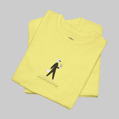 Folded yellow t-shirt with a graphic design on a white background