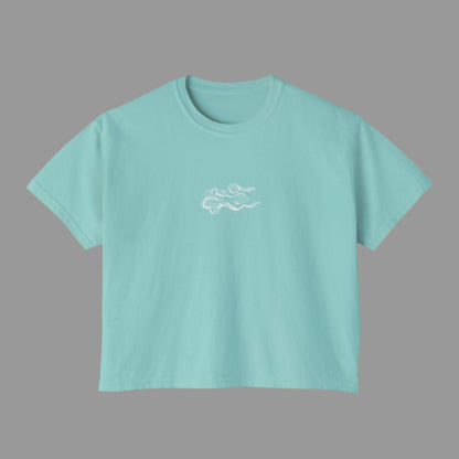 Light blue t-shirt with a small white logo on a white background