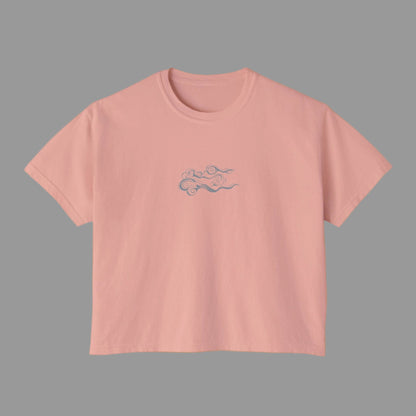 Pink t-shirt with a small design on a white background