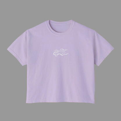 Lavender t-shirt with a small white logo on a white background