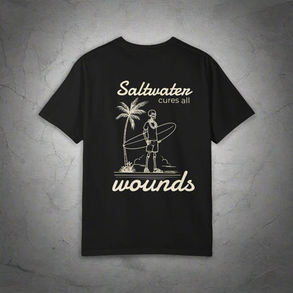 Black t-shirt with white graphic and text 'Saltwater cures all wounds' on a white background