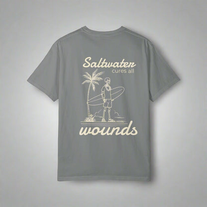 Gray t-shirt with a graphic and text 'Saltwater cures all wounds' on a white background