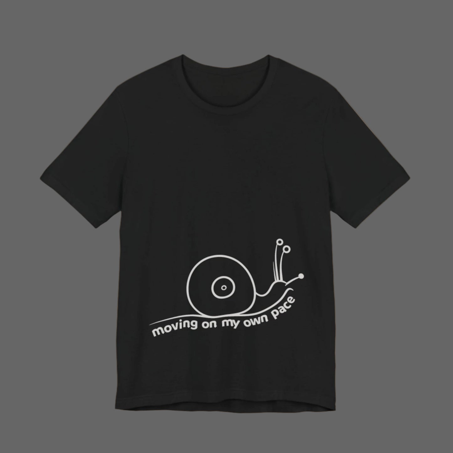 Black t-shirt with a white snail graphic and text on a white background