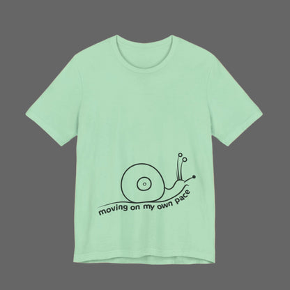 Mint green t-shirt with a snail graphic and text on a white background