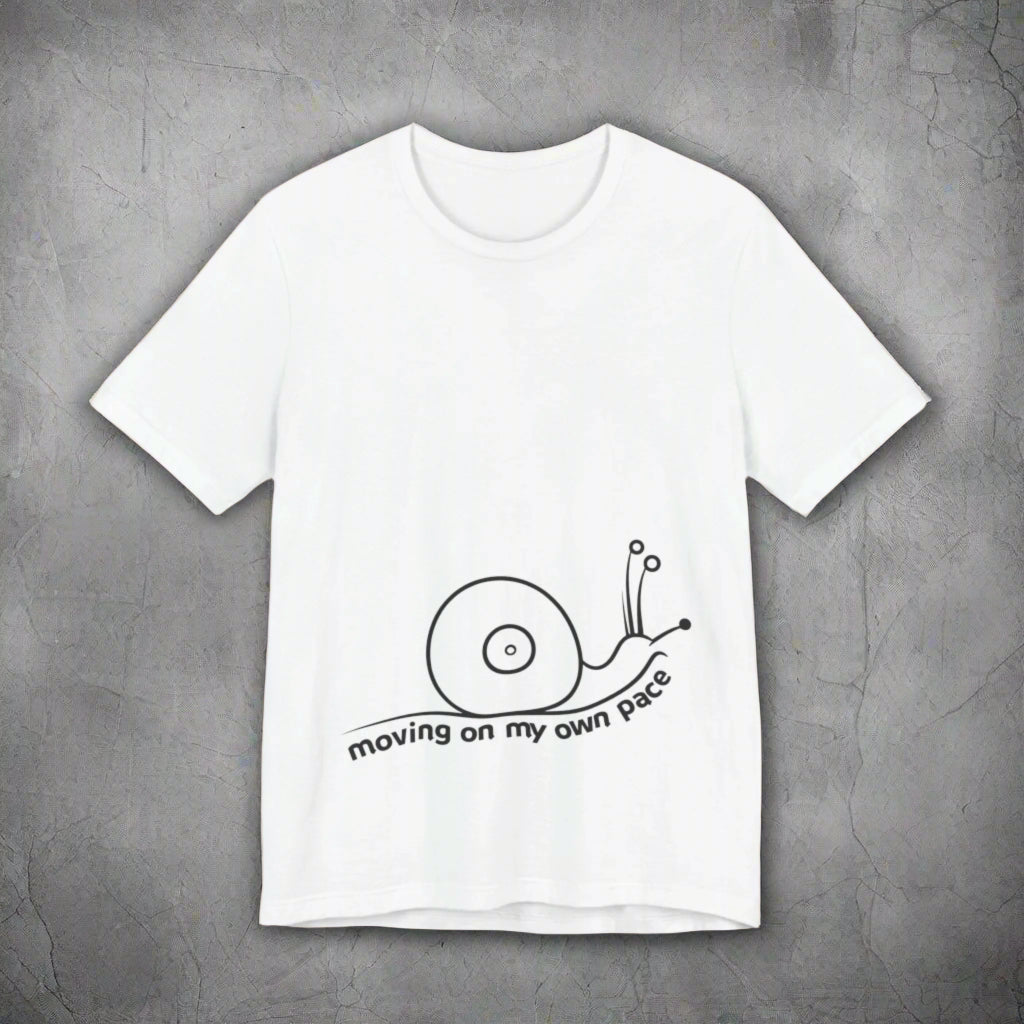 White t-shirt with a black snail graphic and text on a white background