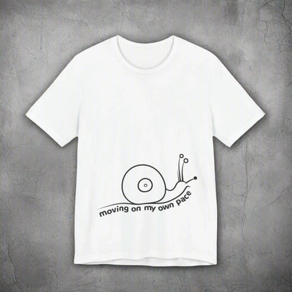 White t-shirt with a black snail graphic and text on a white background