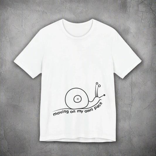 White t-shirt with a black snail graphic and text on a white background
