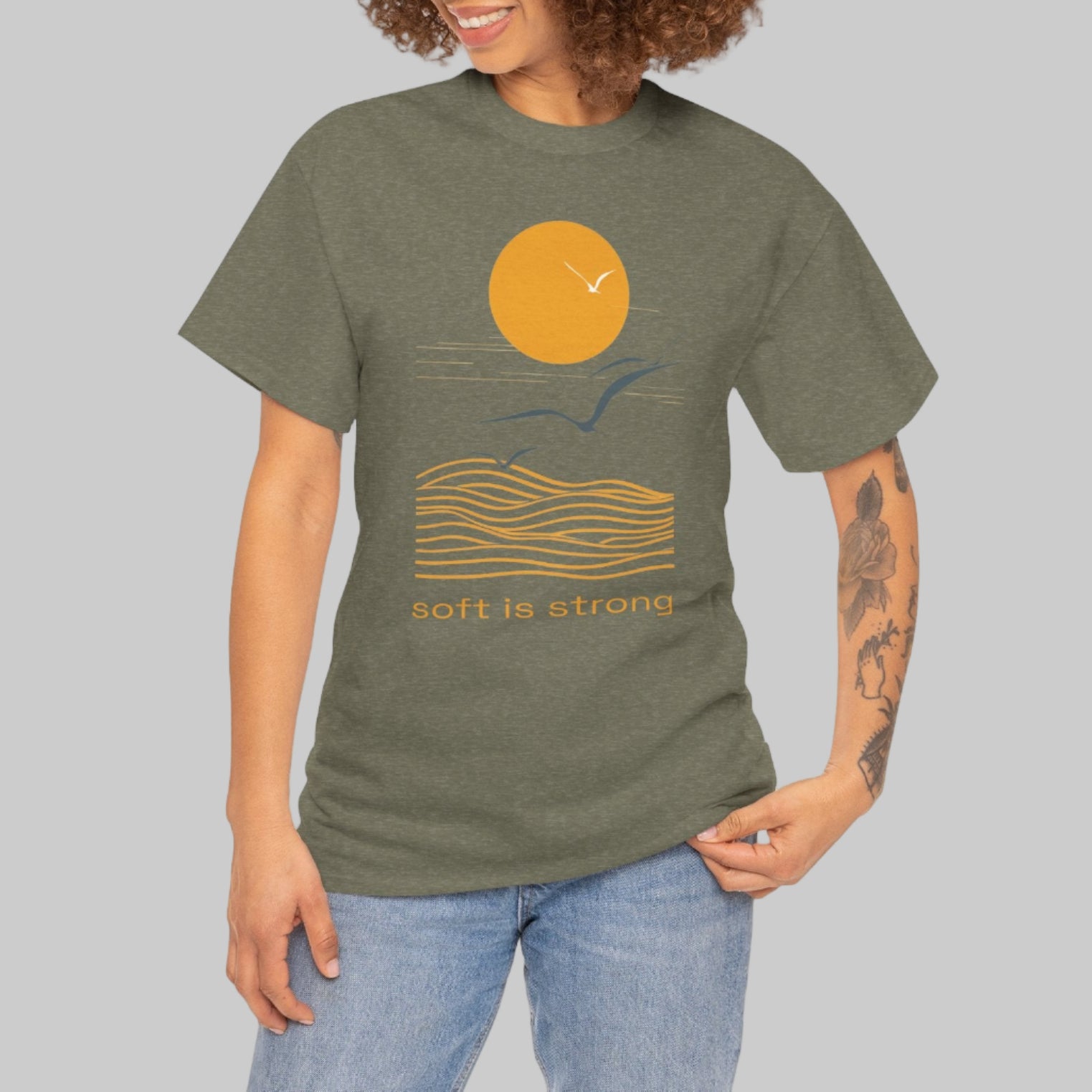 Woman wearing a green t-shirt with a graphic design on a white background