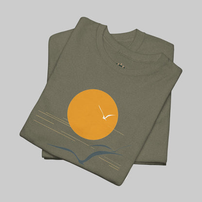 Folded green t-shirt with a sun and bird design on a white background