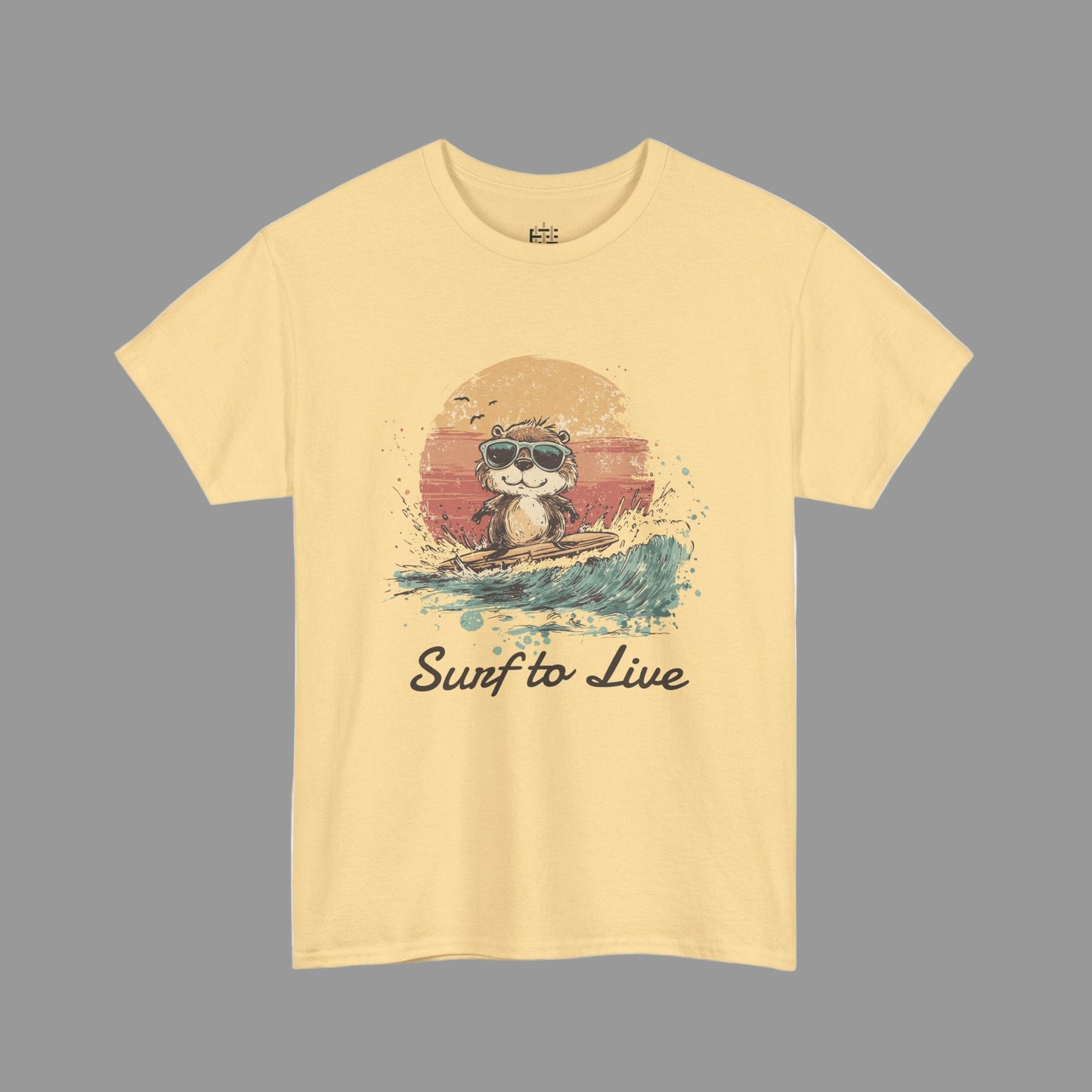 Yellow t-shirt with a graphic of a raccoon surfing and 'Surf to Live' text on a white background