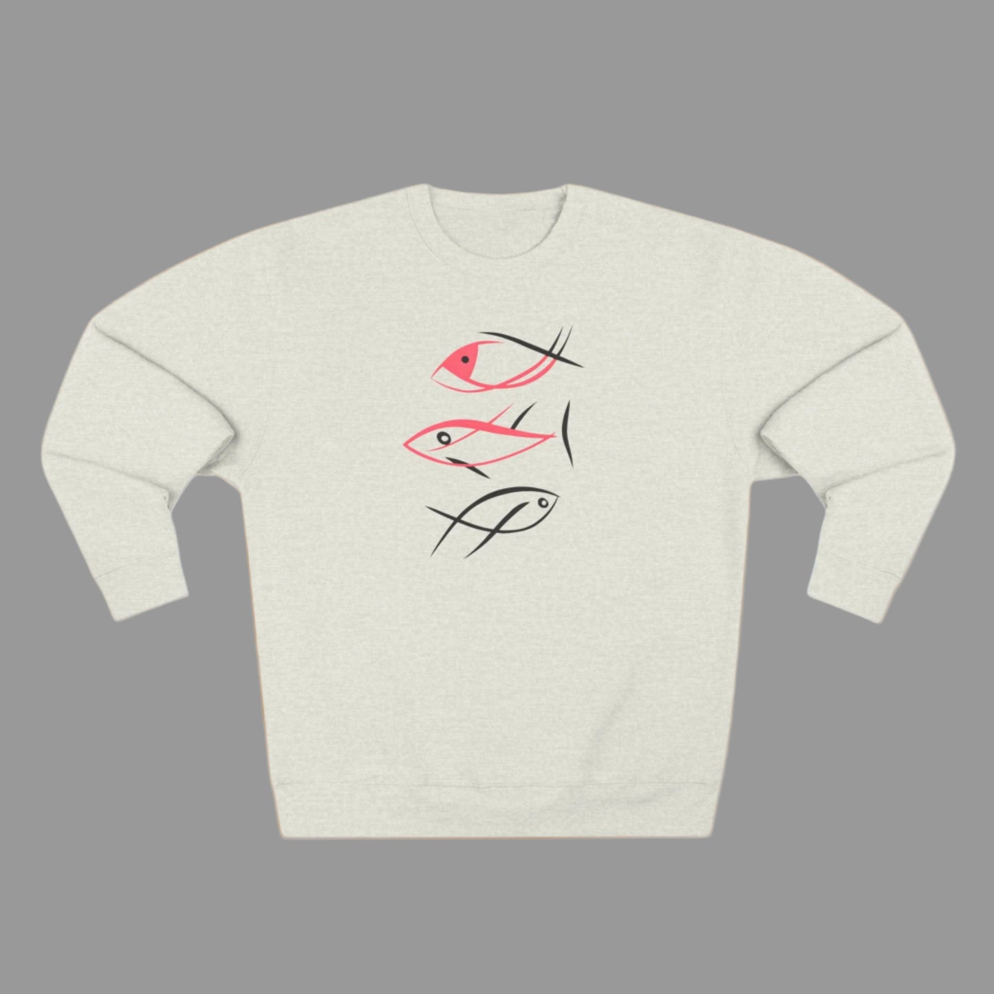 A person wearing a gray crewneck sweatshirt with a minimalist fish graphic design in pink and black.