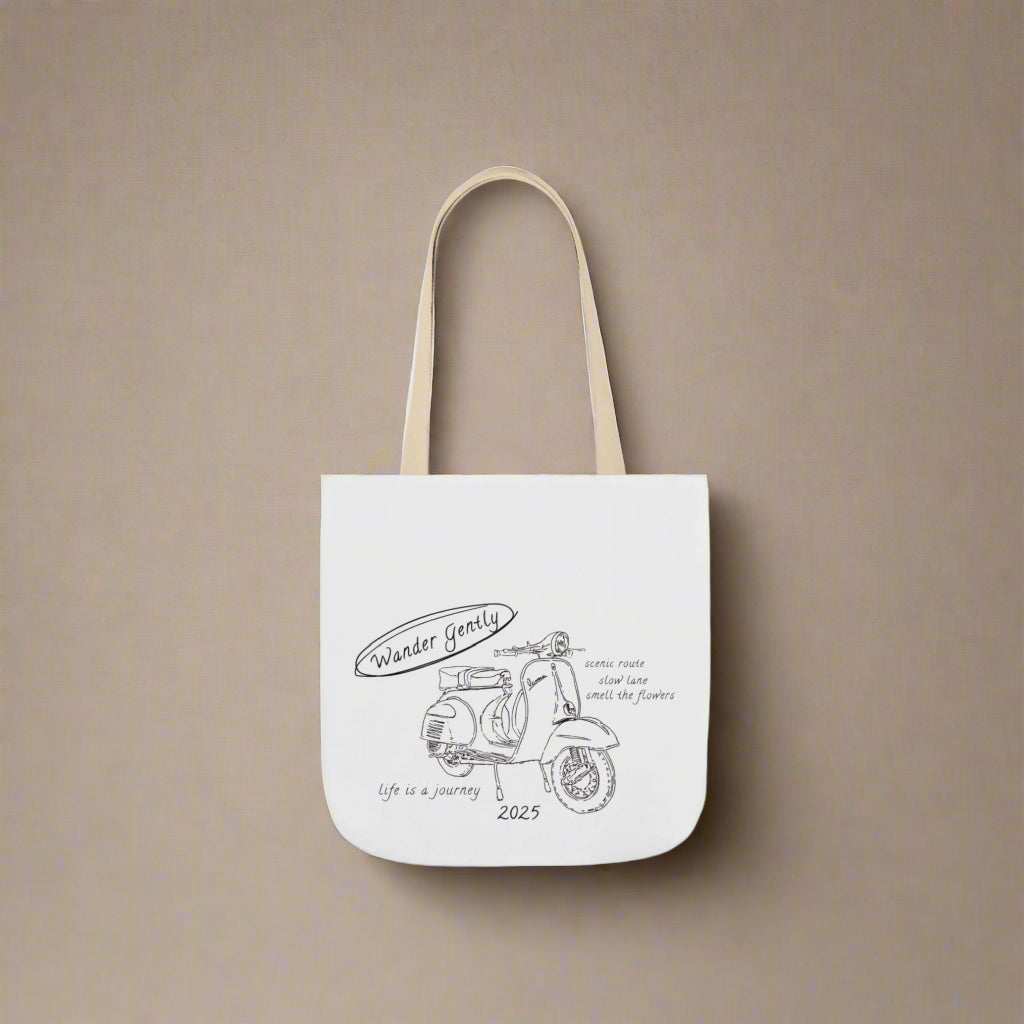 White tote bag with scooter design and text on a white background