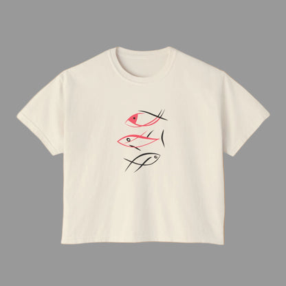 Beige t-shirt with fish illustrations on a white background