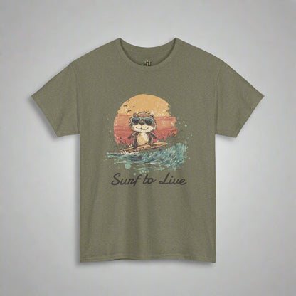 Olive green t-shirt with a graphic of a cat surfing and 'Surf to Live' text on a white background