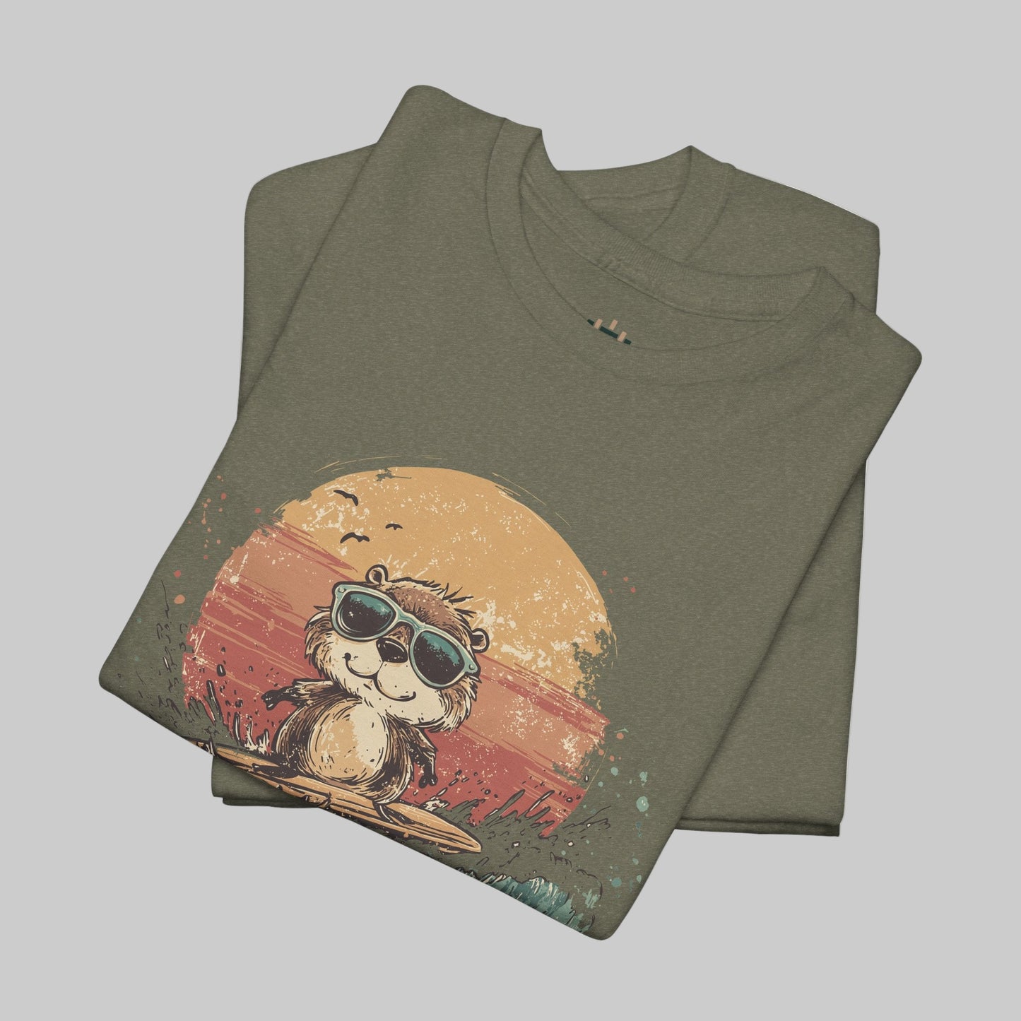 Folded t-shirt with a graphic of a bear wearing sunglasses and a sunset design on a white background