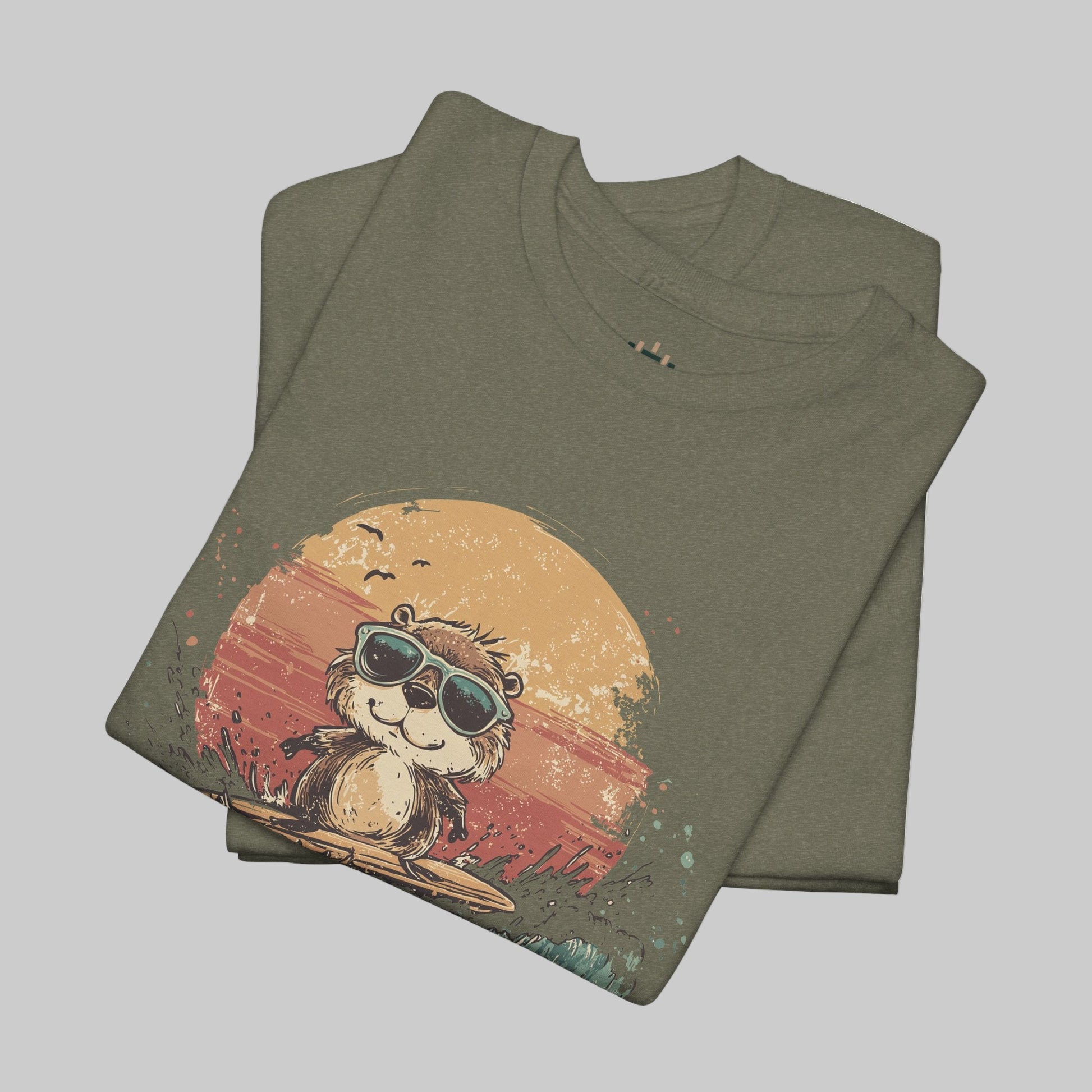 Folded t-shirt with a graphic of a bear wearing sunglasses and a sunset design on a white background