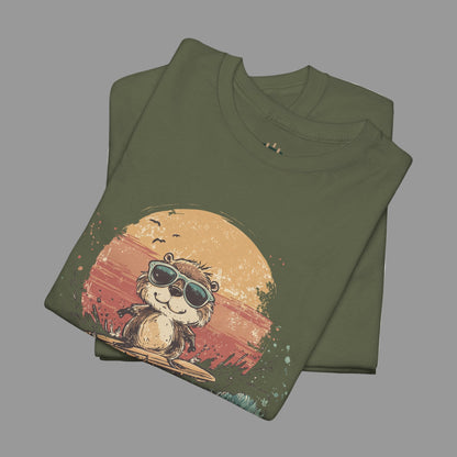 Folded green t-shirt with a graphic of a monkey wearing sunglasses on a sunset background.