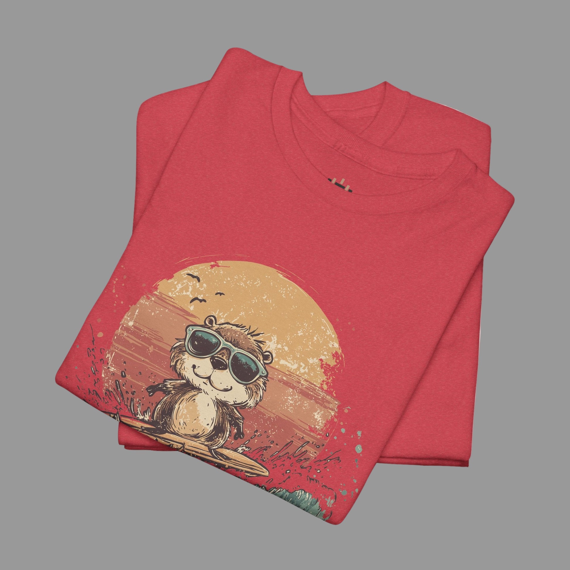 Folded red t-shirt with a graphic of a monkey wearing sunglasses and a hat on a sunset background.