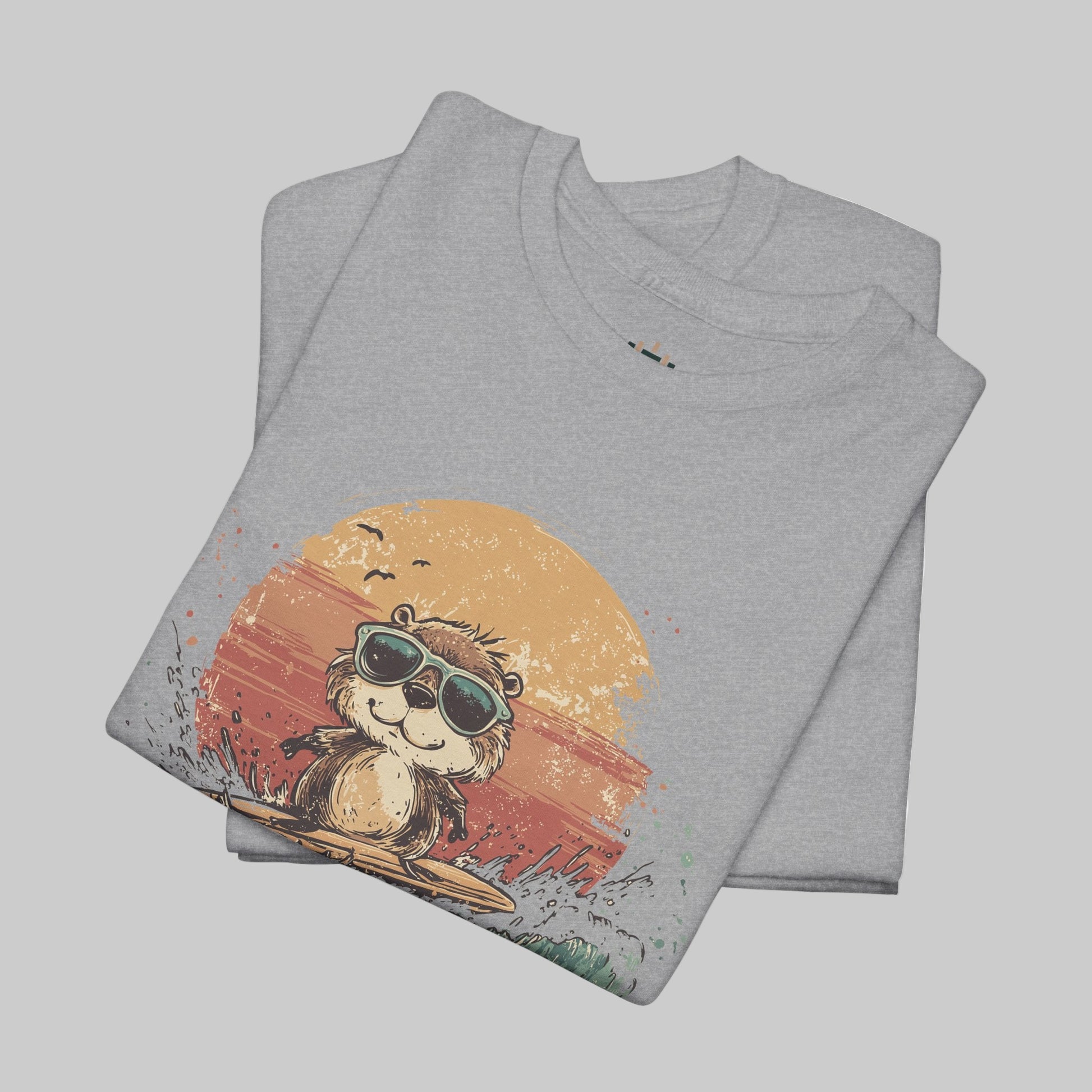 Folded gray t-shirt with a graphic of a bear wearing sunglasses and a sunset design on a white background.