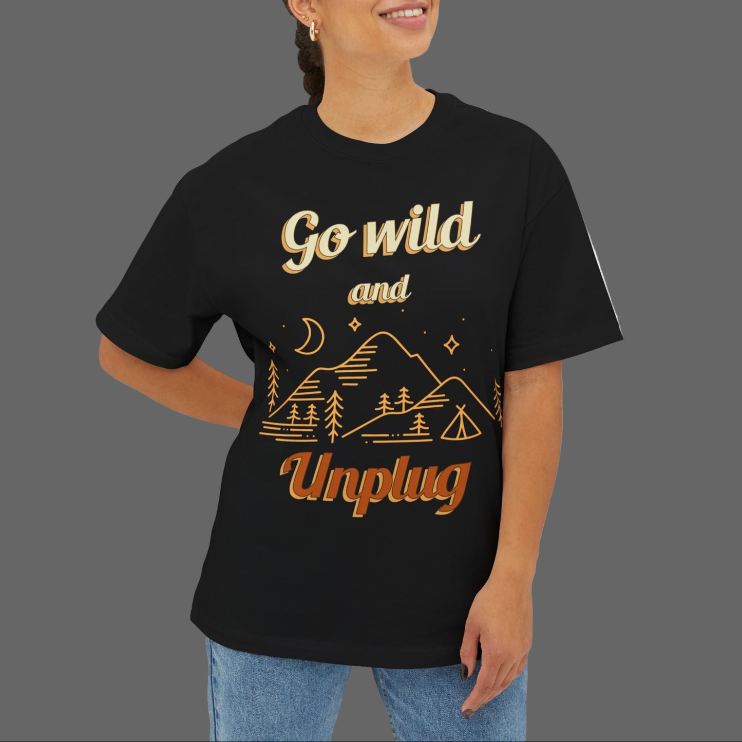 Person wearing a black t-shirt with 'Go wild and Unplug' text and graphics on a white background