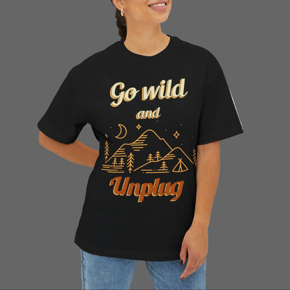 Person wearing a black t-shirt with 'Go wild and Unplug' text and graphics on a white background