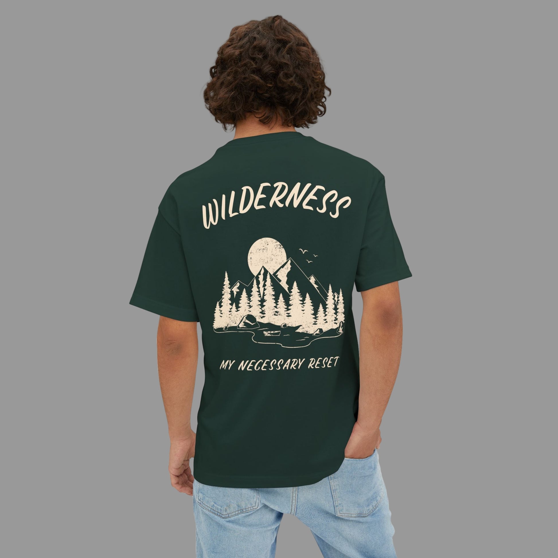 Person wearing a green t-shirt with a nature-themed design and text on the back.