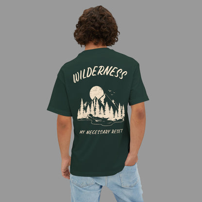 Person wearing a green t-shirt with a nature-themed design and text on the back.