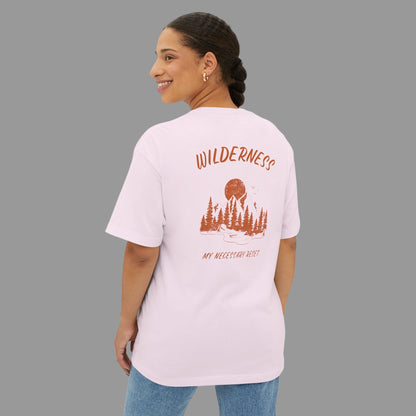 Woman wearing a light pink t-shirt with a nature-themed design on the back, standing against a white background.