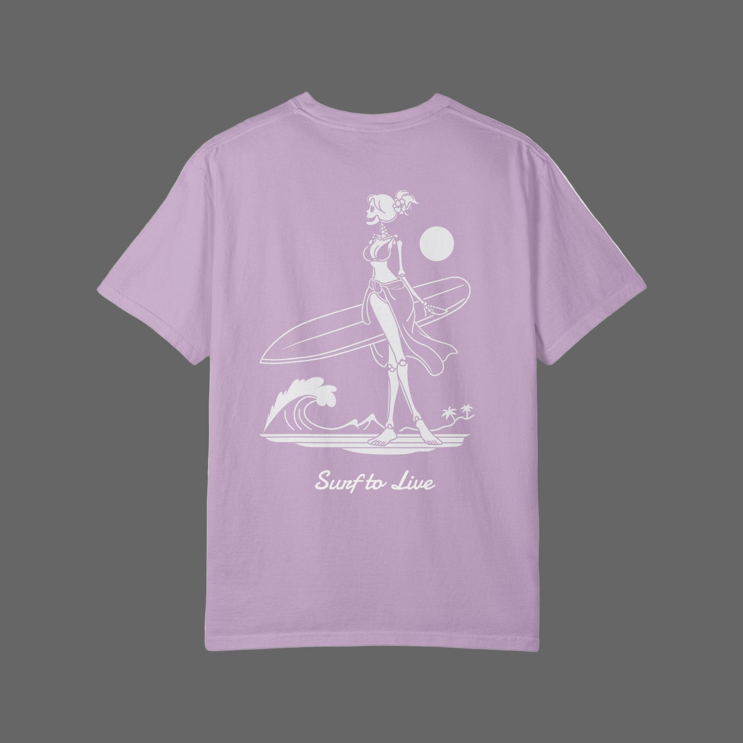 Lavender t-shirt with a graphic of a woman holding a surfboard and text 'Surf to Live' on a white background