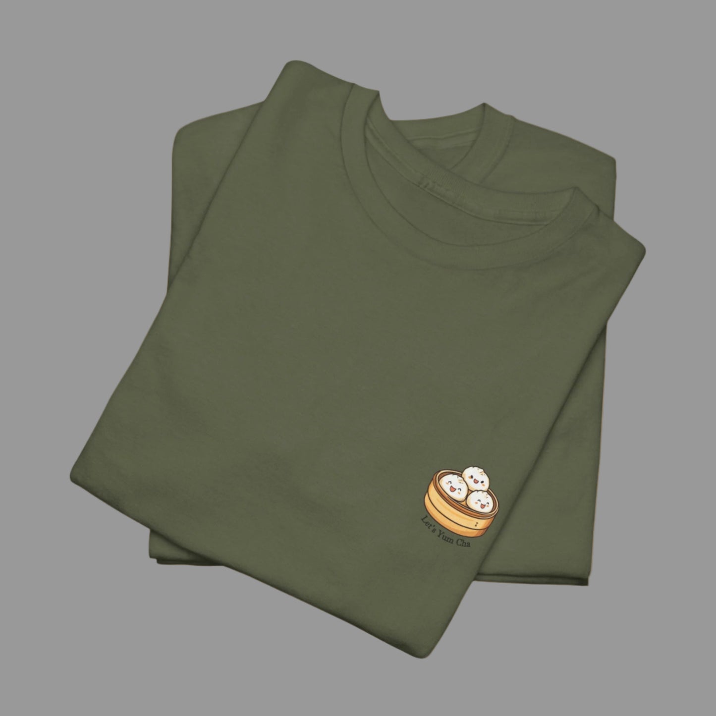 Folded green t-shirt with a small logo on a white background