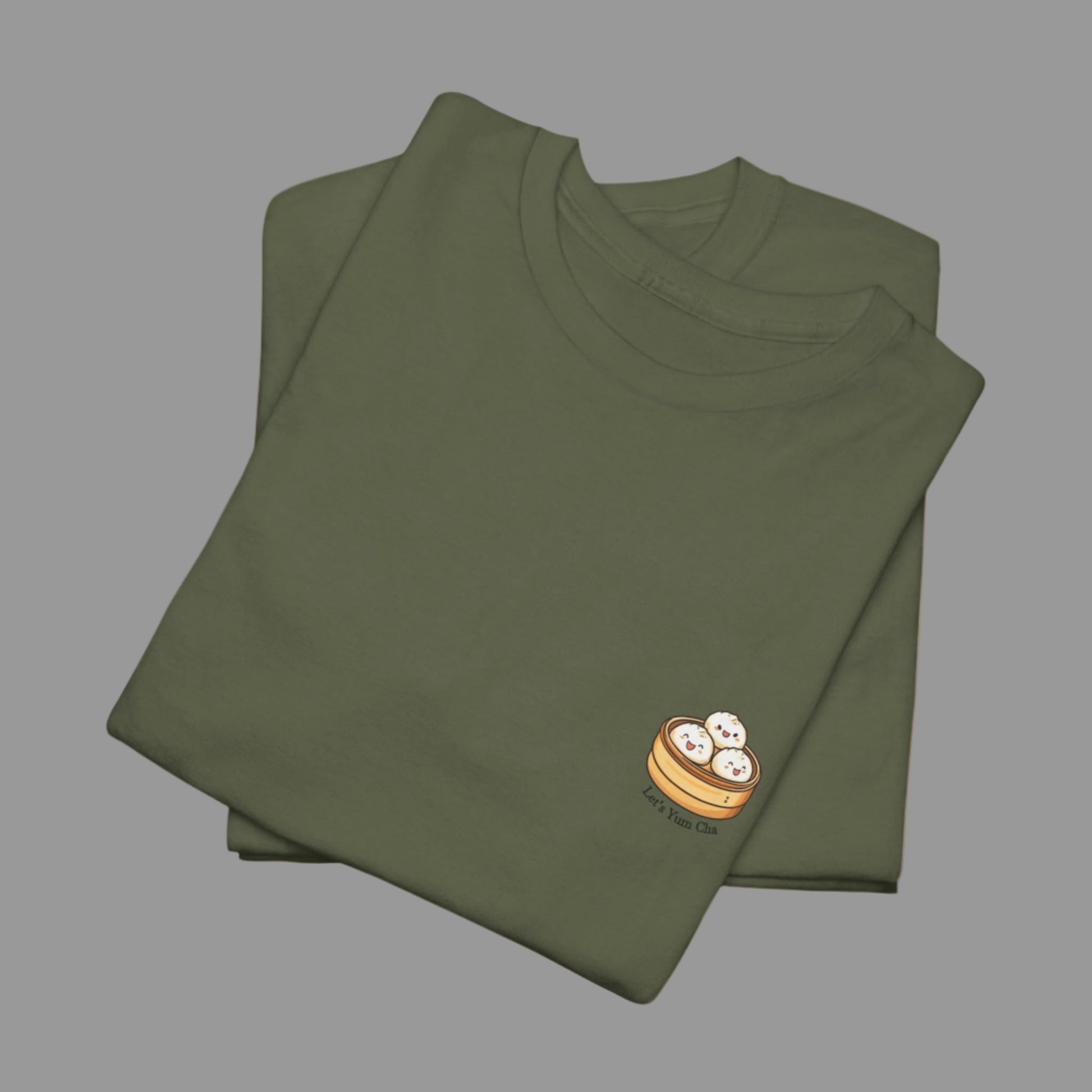 Folded green t-shirt with a small logo on a white background