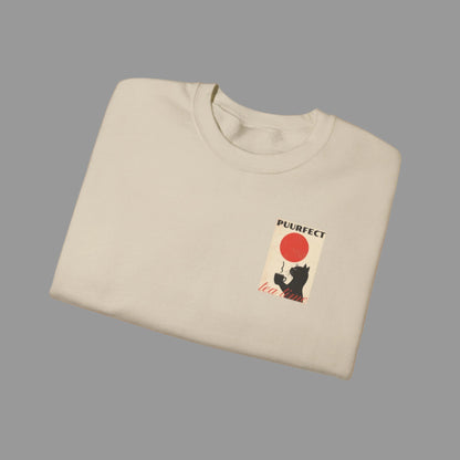 Folded beige sweatshirt with a graphic design on a white background