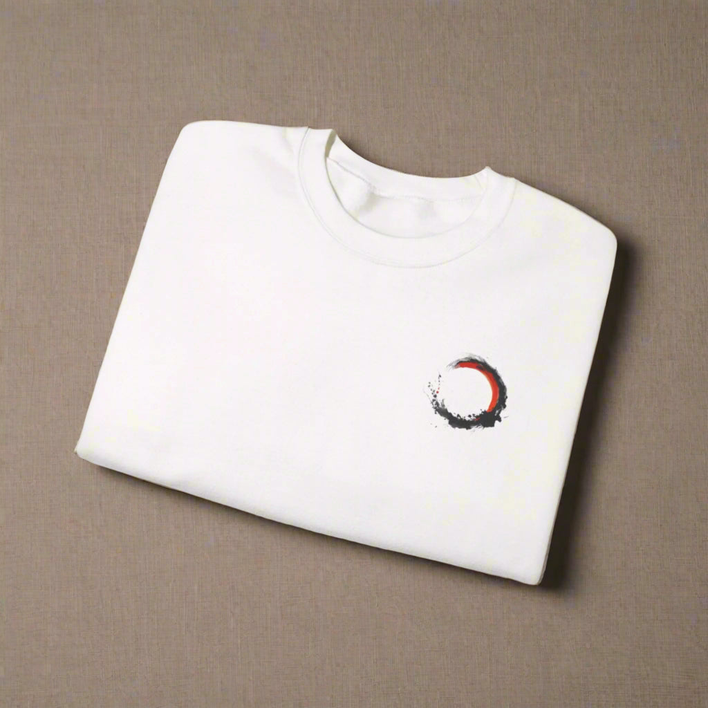 White sweatshirt with a red and black circular design on a white background