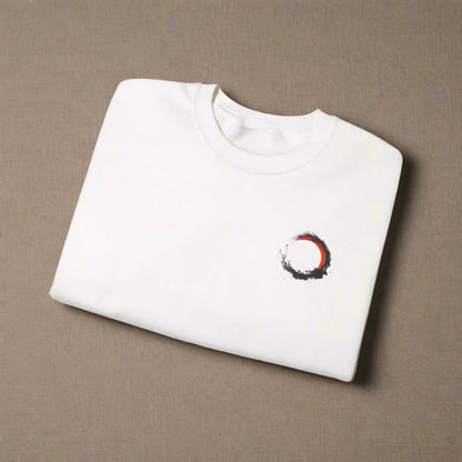 White sweatshirt with a red and black circular design on a white background